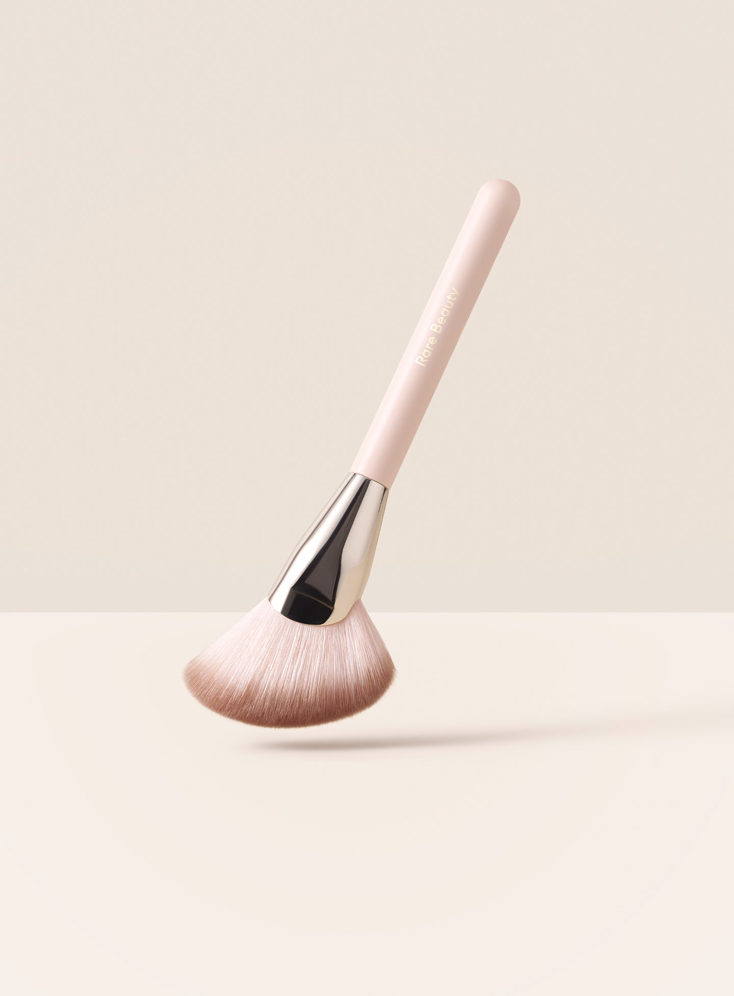 Rare Beauty Angled Powder Brush is a multiuse powder brush for seamlessly blending powder and cream products
