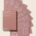 Rare Beauty's Find Comfort Hydrating Under Eye Patches spread out in a semi-circle, designed cool and smooth the under eye area for a refreshed look in minutes.