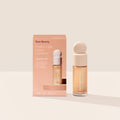 Rare Beauty's Positive Light Liquid Luminizer Mini in the champagne shade Exhilarate.