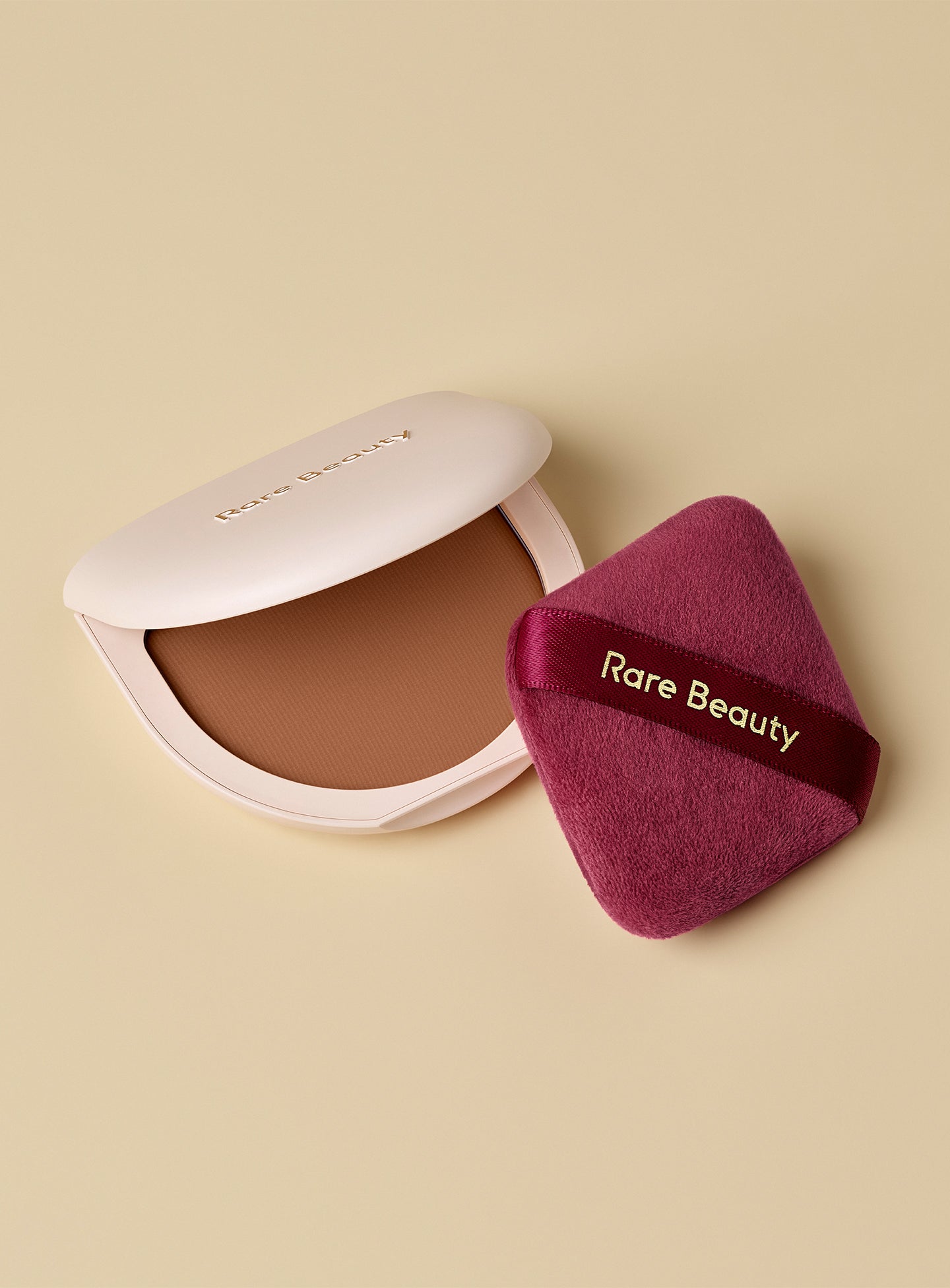 Rare Beauty's True to Myself Tinted Pressed Finishing Powder and Soft Touch Powder Puff.