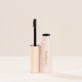 A tube of Rare Beauty's Brow Harmony Flexible Lifting Gel and its brush.