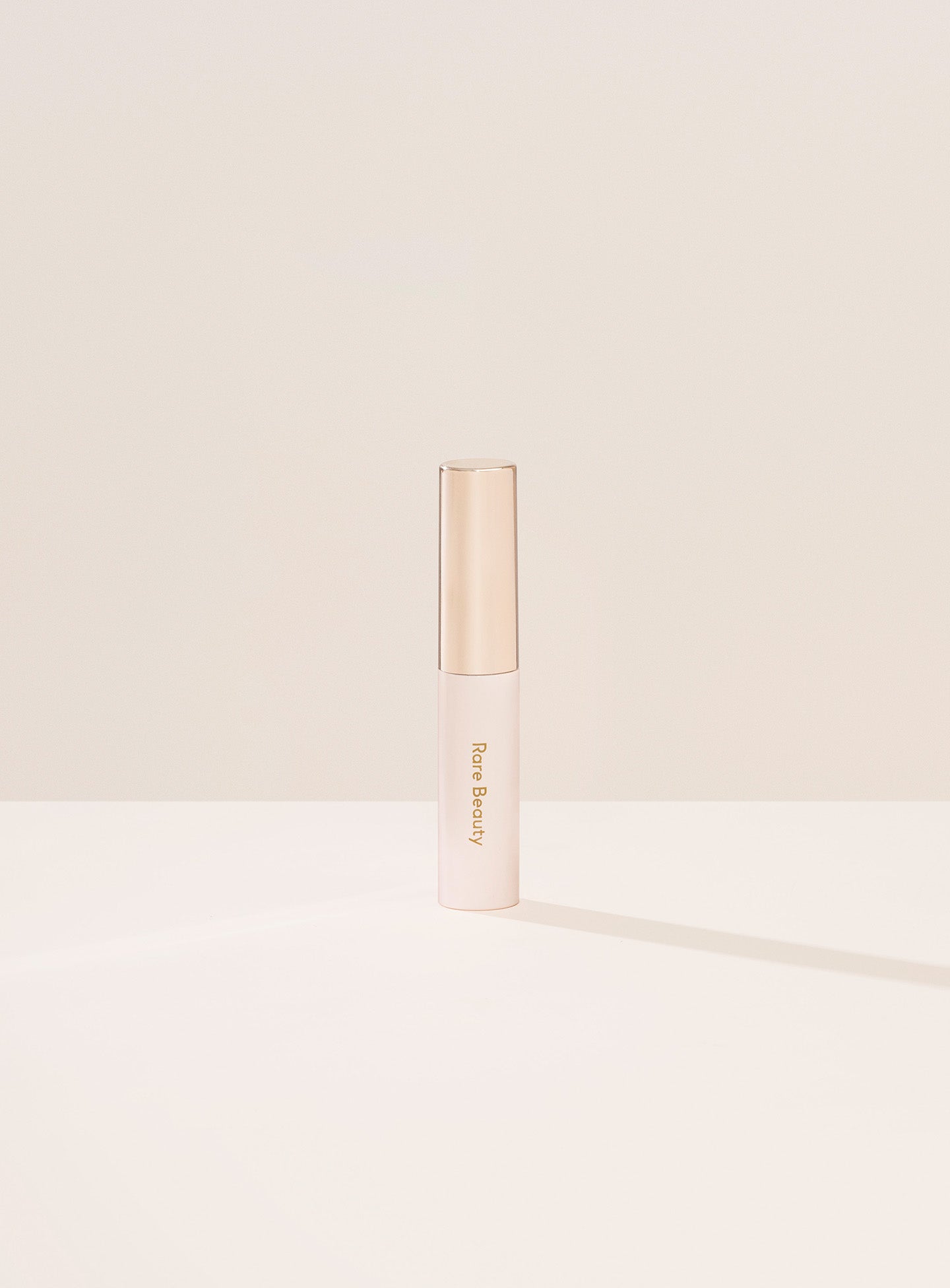 Minimalistic image of Rare Beauty's Brow Harmony Flexible Lifting Gel packaging.