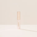 Minimalistic image of Rare Beauty's Brow Harmony Flexible Lifting Gel packaging.