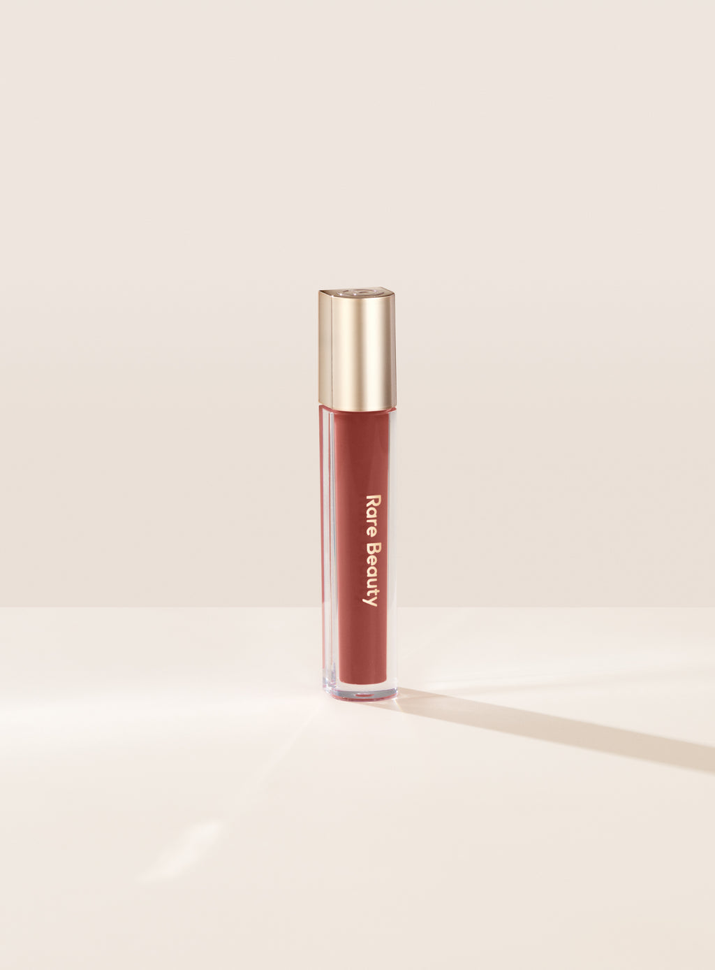 Rare Beauty Nearly Apricot Stay Vulnerable Glossy Lip Balm Review
