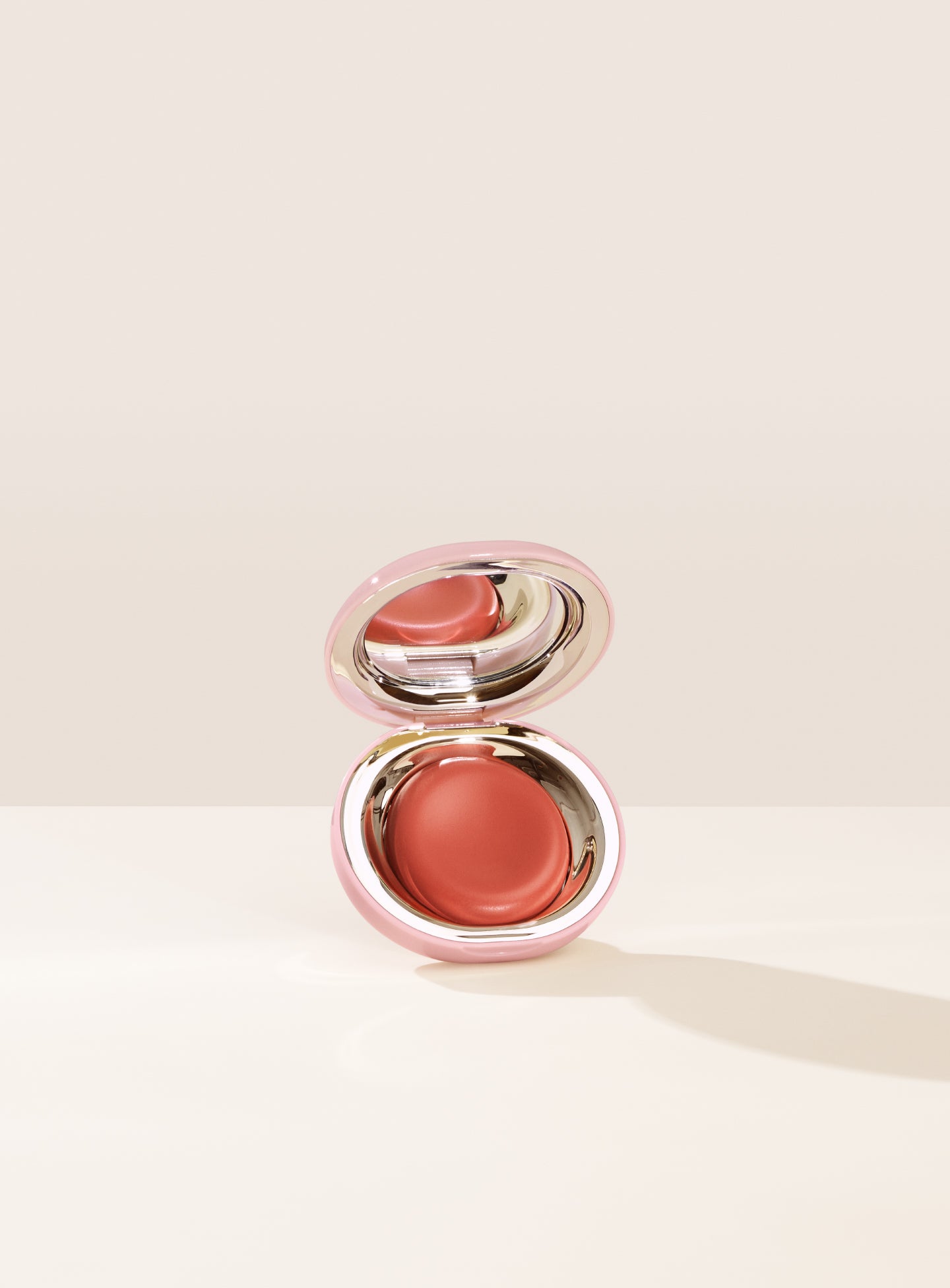Shade Nearly Apricot, in a muted coral, of Rare Beauty's Stay Vulnerable Melting Blush.