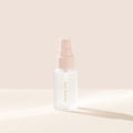 Rare Beauty's Always an Optimist 4-In-1 Mist Mini with the cap off, designed to hydrate, prime, set, and refresh skin.